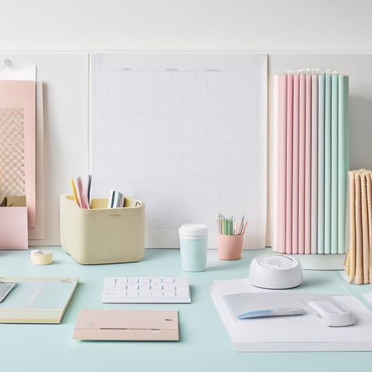 A tidy, minimalist workspace with various stick-on organizers in pastel colors, holding office supplies, papers, and cords, against a clean white background, with soft, natural light.